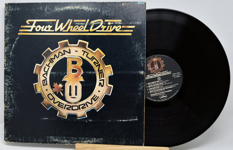 Vinyl record with cover featuring 'Four Wheel Drive' branding on a white background