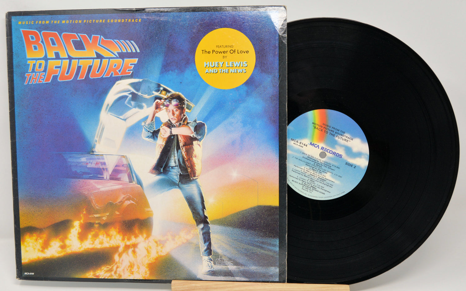 Vinyl record and cover for 'Back to the Future' movie soundtrack on a white background