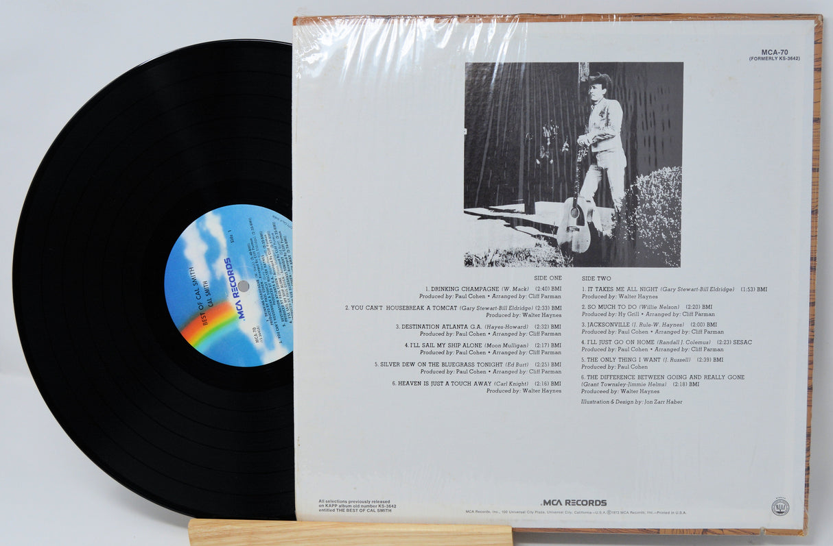 Back cover and record of 'The Best of Cal Smith' vinyl LP showing song list and black-and-white photo