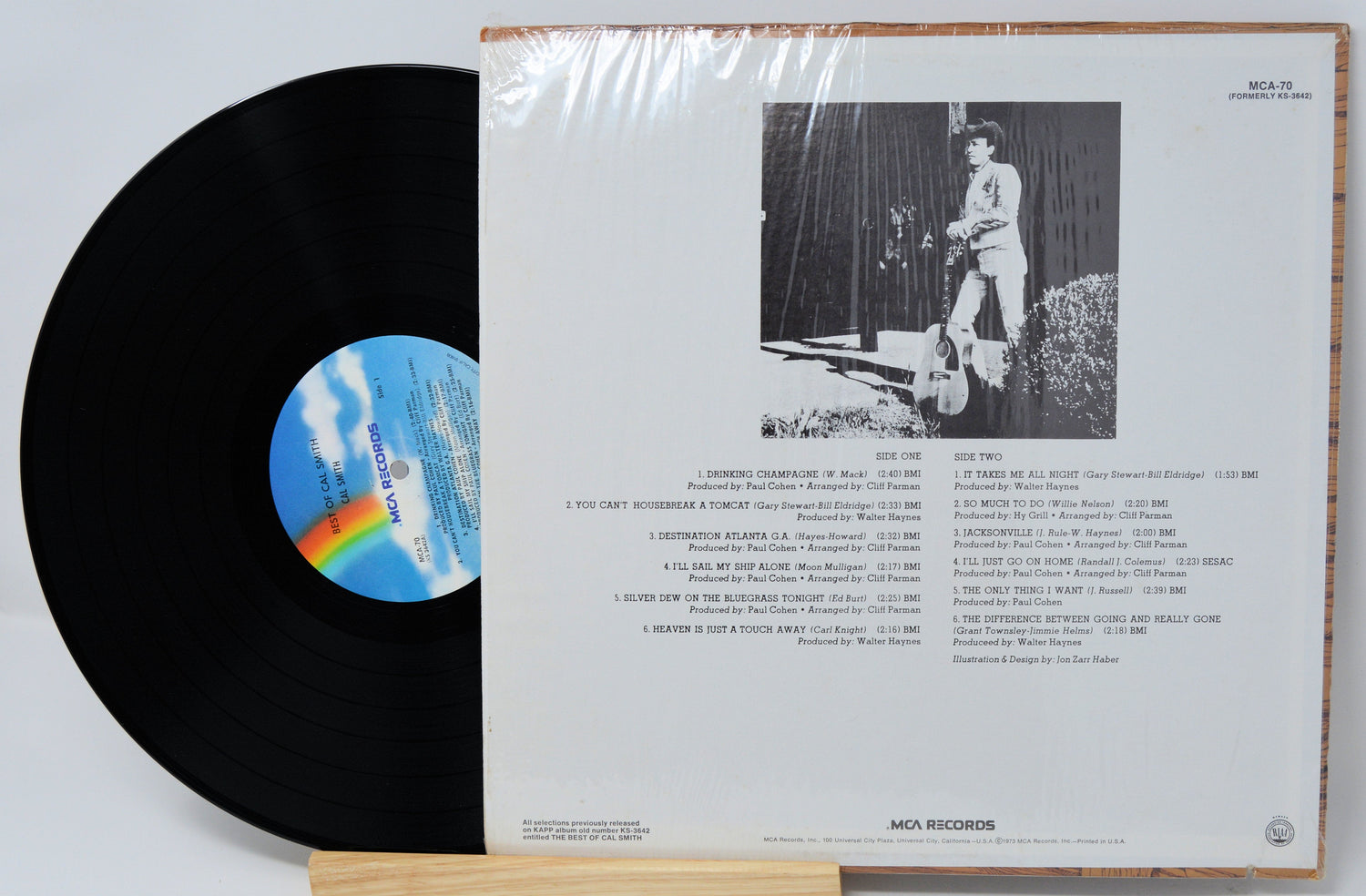 Back cover and record of 'The Best of Cal Smith' vinyl LP showing song list and black-and-white photo