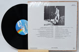 Back cover and record of 'The Best of Cal Smith' vinyl LP showing song list and black-and-white photo