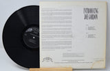 Back cover and vinyl record of 'Introducing Joe Gordon 1954' jazz album displaying tracklist and liner notes