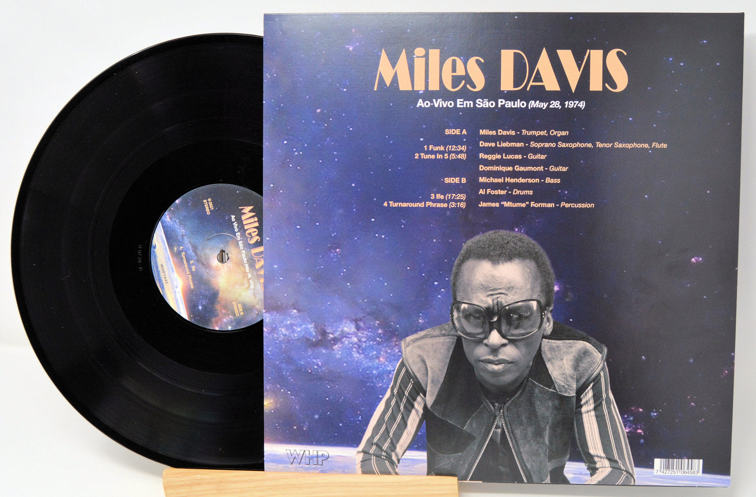 Miles Davis Ao Vivo Em São Paulo 1974 vinyl album back cover showing tracklist and band credits with cosmic background
