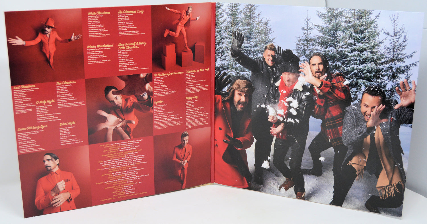 Backstreet Boys Christmas album vinyl gatefold showing song list and playful band photo in snowy scene