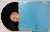 Vinyl record with a blue cover featuring text and graphics.