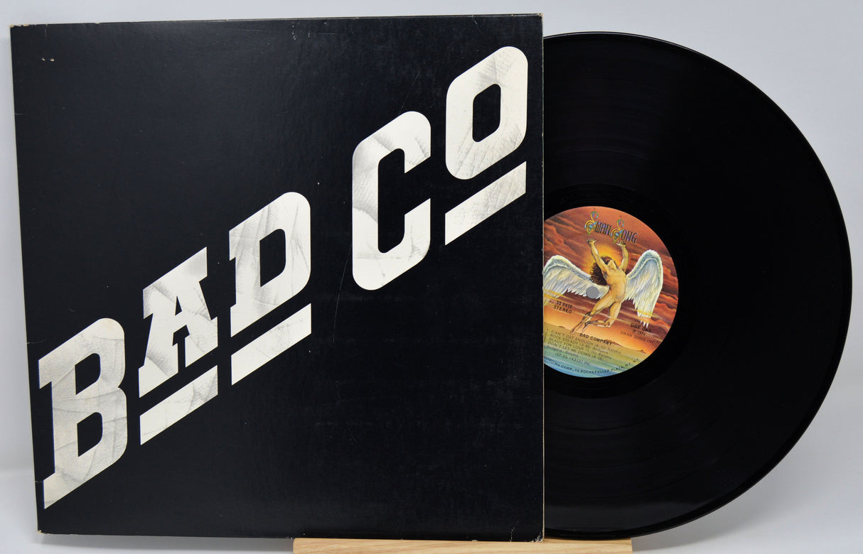 Vinyl record with 'Bad Company' album cover featuring an angel illustration.