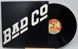 Vinyl record with 'Bad Company' album cover on a white background