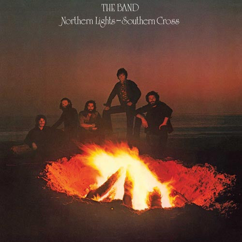 Album cover of 'Northern Lights - Southern Cross' by The Band with a group of people around a campfire.