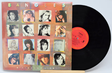 Used vinyl record of The Bangles - Different Light with album cover featuring band photos.