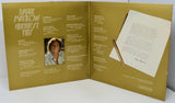 Album cover with a pencil and sheet of paper on a white background