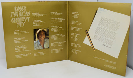 Album cover with a pencil and sheet of paper on a white background
