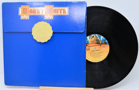 Vinyl record with blue cover and 'Harry White' branding on a light blue background