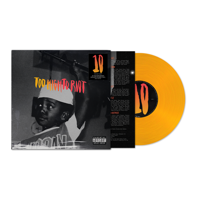 Vinyl record with orange disc and black and white cover featuring a person wearing a cap.