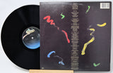 Vinyl record with a colorful album cover on a white background