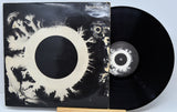 Vinyl record with its cover featuring abstract design and 'bauhaus' branding.