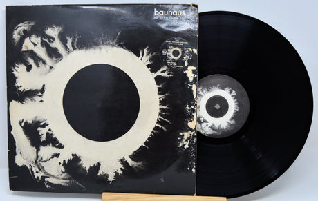 Vinyl record with its cover featuring abstract design and 'bauhaus' branding.