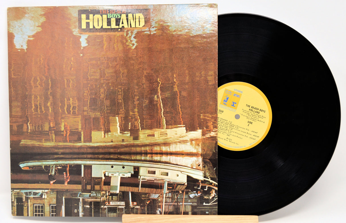 Vinyl record with cover featuring a shipwreck design and 'The Beach Boys Holland' text.