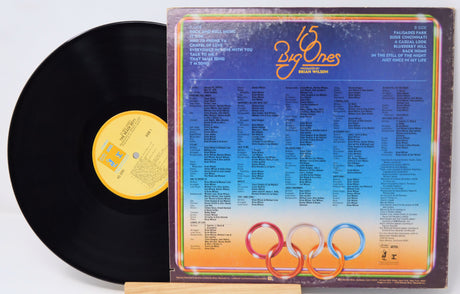 Vinyl record with a colorful cover featuring '15 Big Ones' on a white background