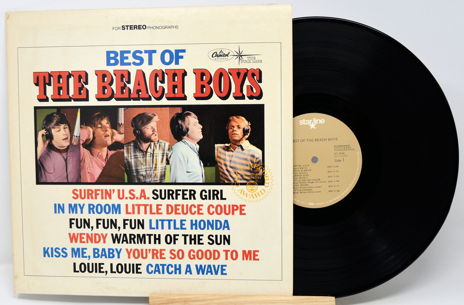Vinyl record with 'The Beach Boys' album cover featuring band members and song titles.