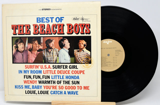 Vinyl record with 'The Beach Boys' album cover featuring band members and song titles.