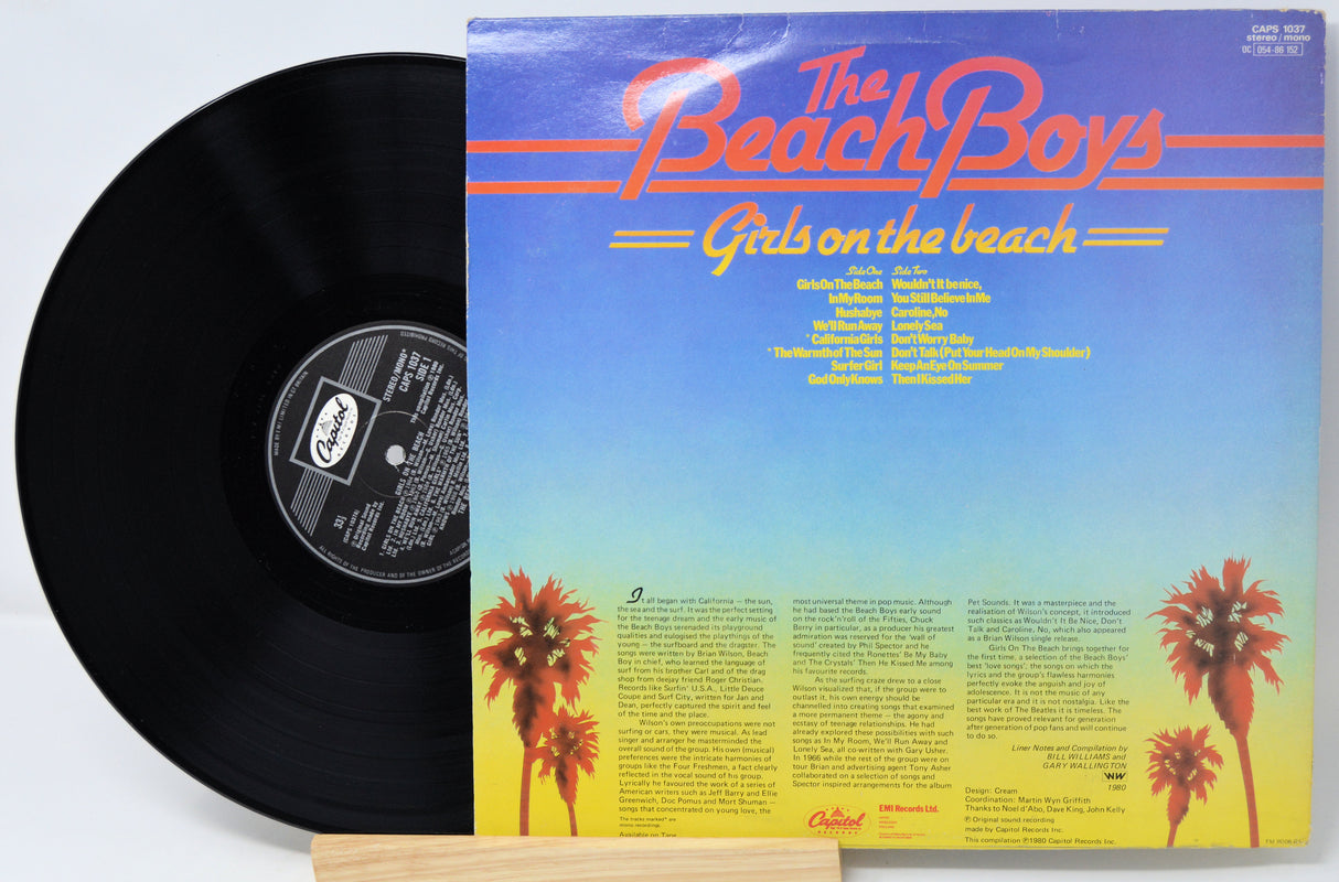Vinyl record with 'The Beach Boys' album 'Girls on the Beach' on a white background
