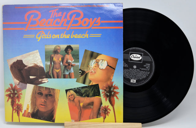 Vinyl record with 'The Beach Boys' album cover featuring beach-themed images.