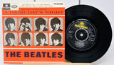 Vinyl record and cover of 'A Hard Day's Night' by The Beatles on a white background