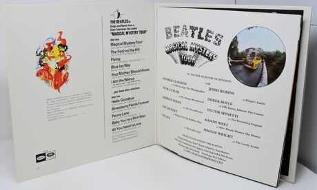 Open book or menu with 'The Beatles' Magical Mystery Tour' design on a white background