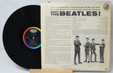 Vinyl record with its cover featuring 'Meet the Beatles!' text and band members.