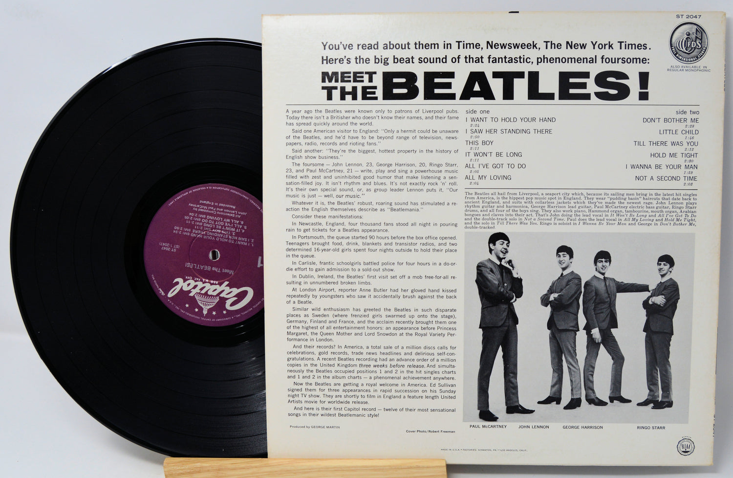 Vinyl record with 'Meet the Beatles!' cover featuring four Beatles members.