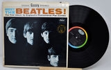 Vinyl record and cover for 'Meet the Beatles!' album on a white background