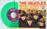 Green vinyl record and album cover of 'What Goes On' by The Beatles