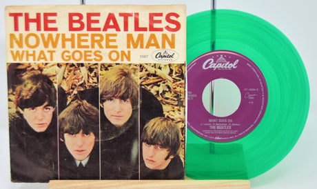 Vinyl record and cover of 'The Beatles' album 'Nowhere Man' with a green vinyl record.