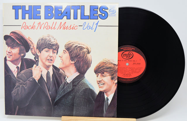 Vinyl record and cover featuring The Beatles with a white background