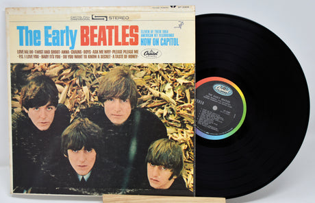 Vinyl record and cover featuring The Beatles with a white background