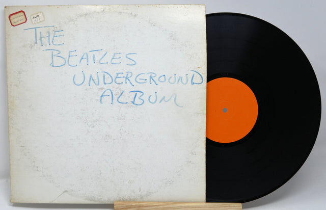 Vinyl record and cover of 'The Beatles Underground Album' on a white background