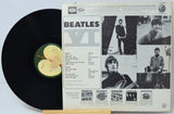 Vinyl record with cover featuring The Beatles' 'Abbey Road' album