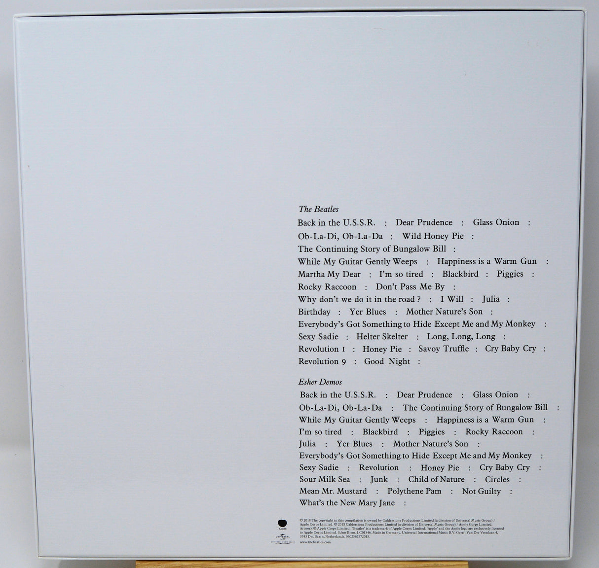 Back cover of a music album with tracklist on a white background