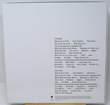 Back cover of a music album with tracklist on a white background