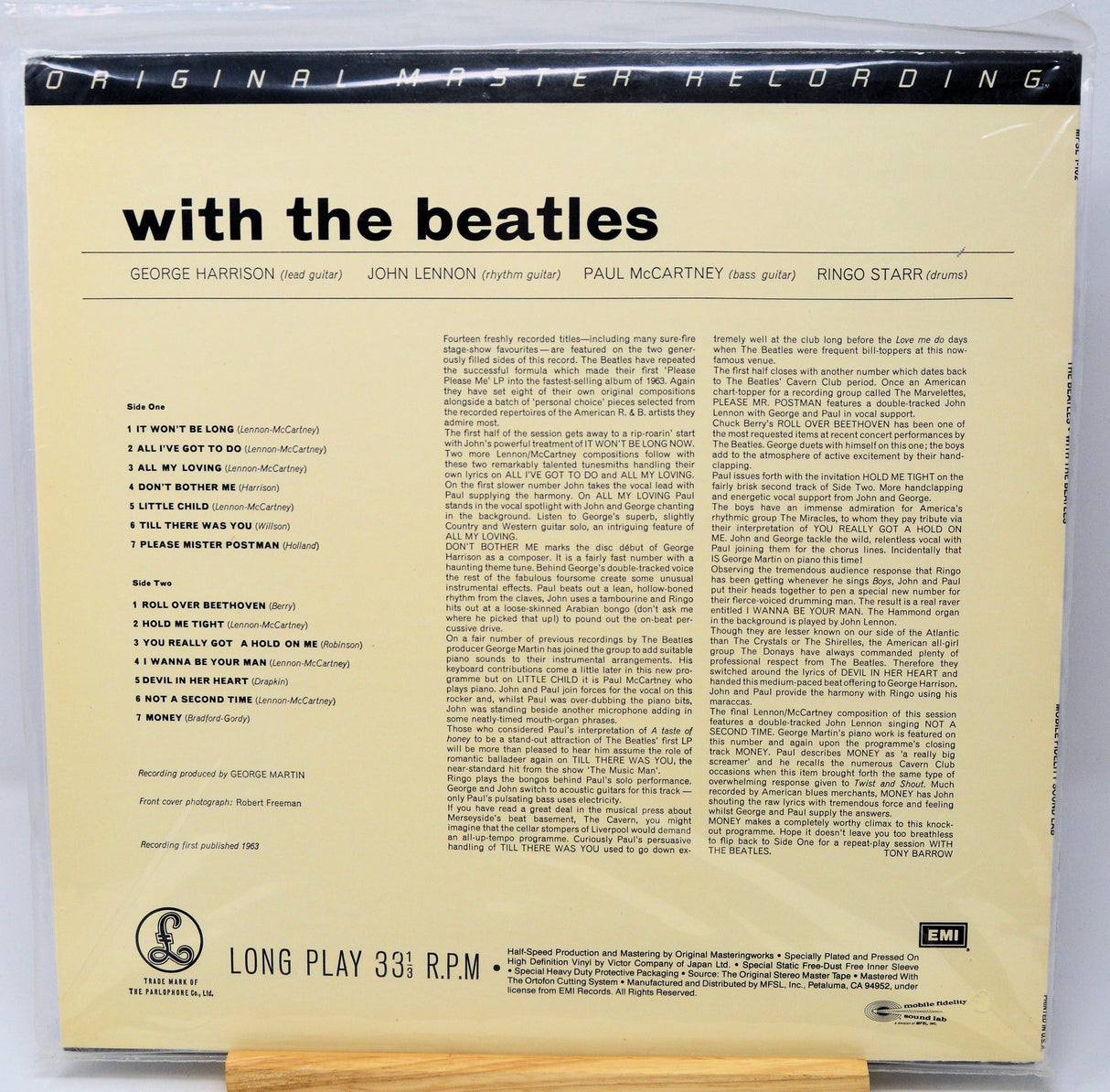 Back cover of a vinyl record with text and album details on a white background