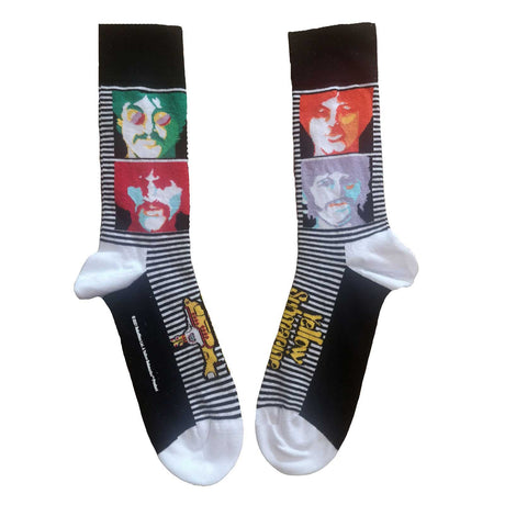 A pair of socks featuring character faces from the Beatles - Yellow Submarine, with a striped pattern and the text 'Yellow Submarine' on the ankle area.