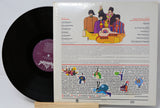 Vinyl record with a colorful cover featuring cartoon characters and text.