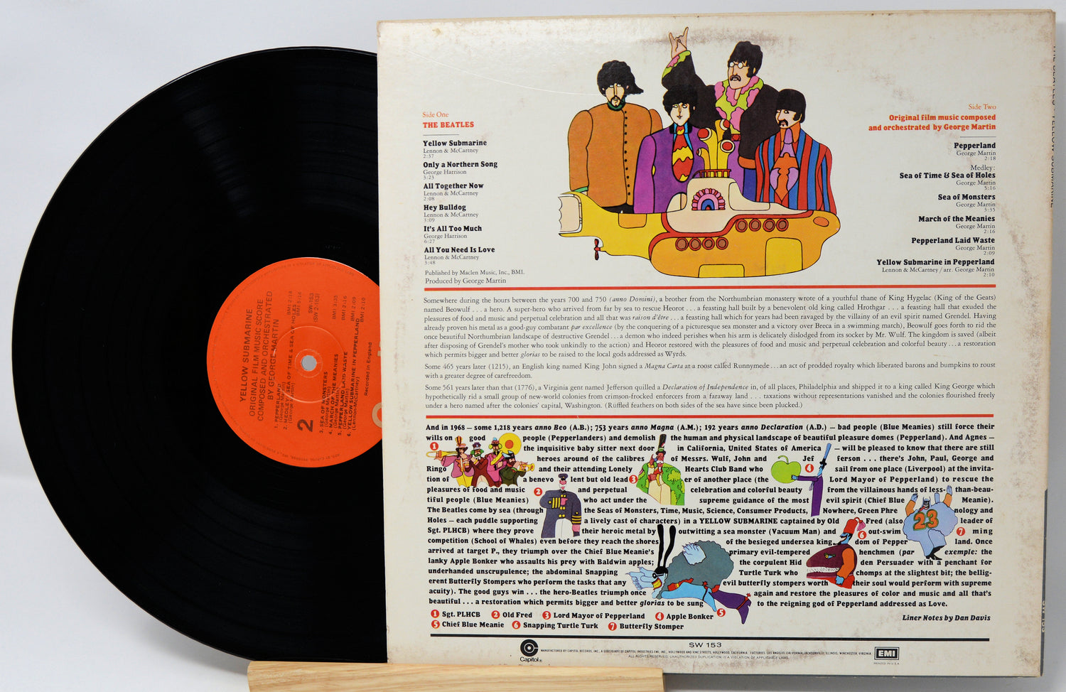 Vinyl record with a colorful cover featuring cartoon characters and text.