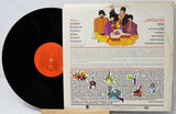 Vinyl record with a colorful cover featuring cartoon characters and text.