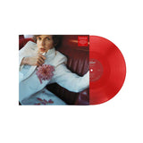 Red vinyl record with a person holding a flower, featuring a cover image.