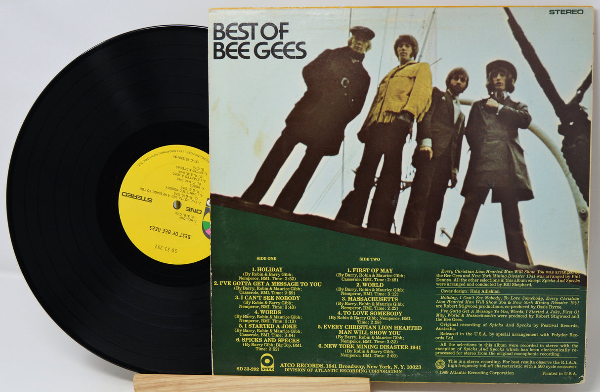 Vinyl record with cover featuring a group of people on a boat, labeled 'Best of Bee Gees'.
