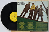 Vinyl record with cover featuring a group of people on a boat, labeled 'Best of Bee Gees'.