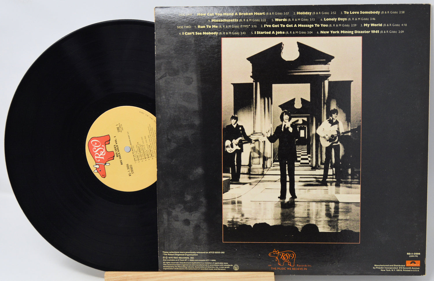 Vinyl record with cover featuring a black and white photo of musicians and album details.