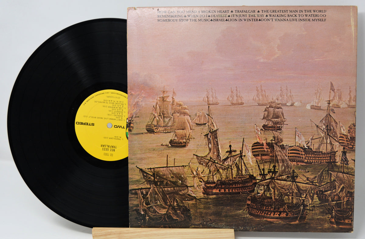 Vinyl record with a ship-themed cover on a light gray background