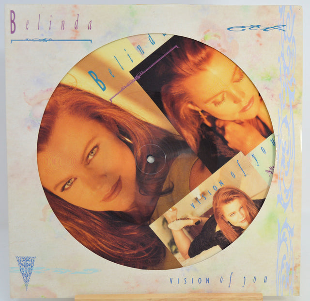 Belinda Carlisle 'Vision of You' picture record album sleeve, featuring a circular printed photo disc with multiple portrait cutouts on a pastel decorated cover.